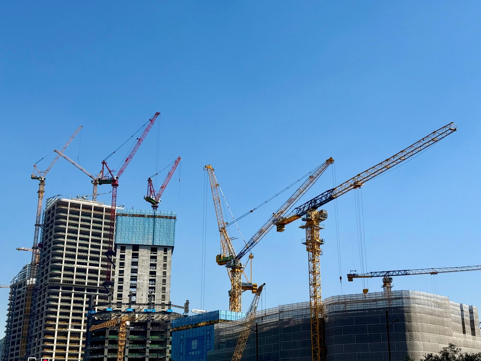 Tower cranes over a city construction site